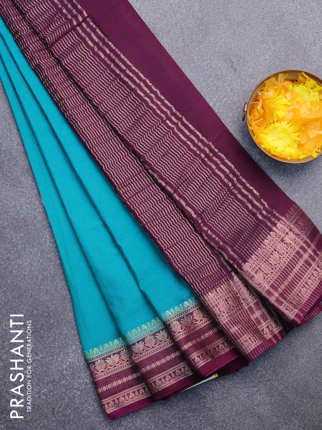 Semi crepe saree teal green shade and deep purple with plain body and zari woven border