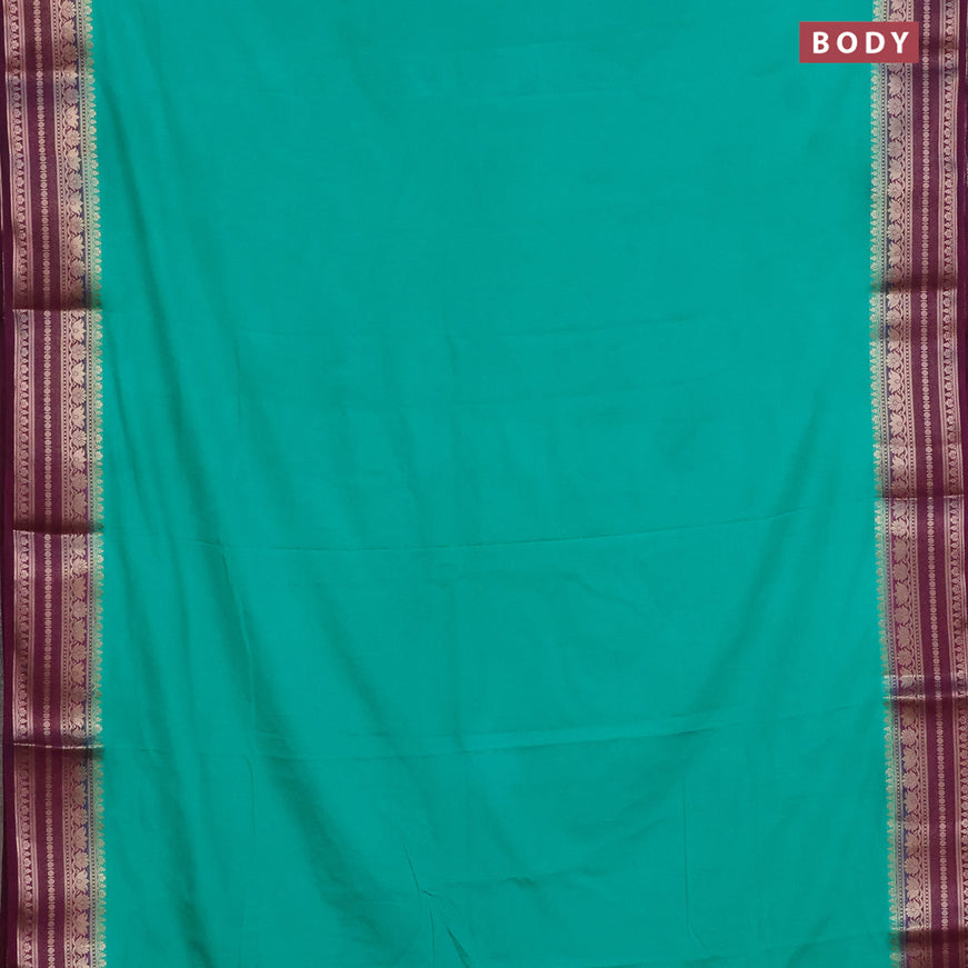 Semi crepe saree teal green and purple with plain body and zari woven border