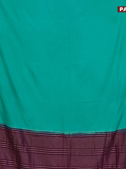 Semi crepe saree teal green and purple with plain body and zari woven border