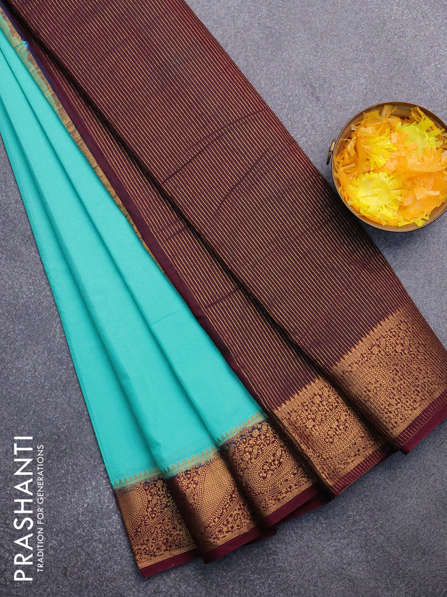 Semi crepe saree teal blue and wine shade with plain body and zari woven border