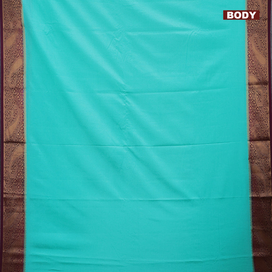 Semi crepe saree teal blue and wine shade with plain body and zari woven border