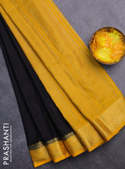 Semi crepe saree black and mango yellow with plain body and zari woven border