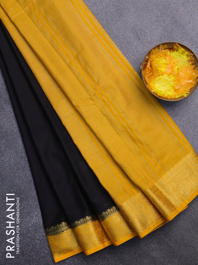 Semi crepe saree black and mango yellow with plain body and zari woven border