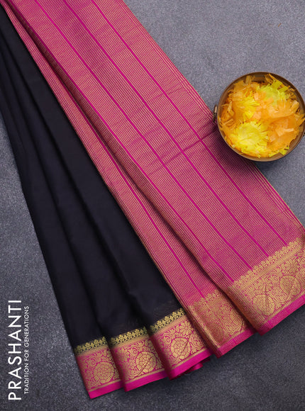 Semi crepe saree black and pink with plain body and zari woven border