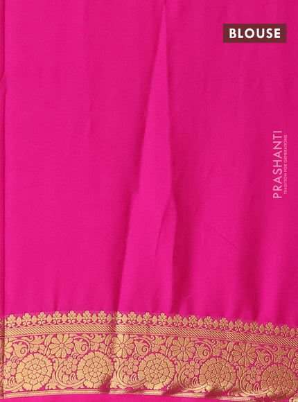 Semi crepe saree black and pink with plain body and zari woven border