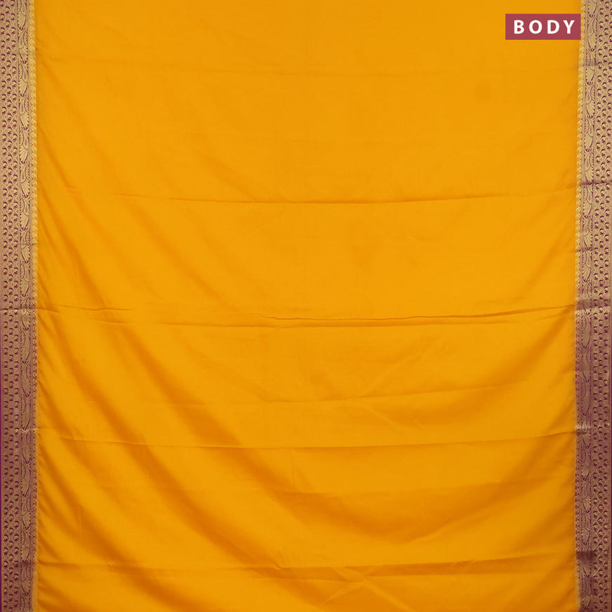 Semi crepe saree mango yellow and purple with plain body and zari woven border