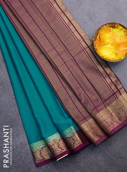 Semi crepe saree teal blue and purple with plain body and zari woven border