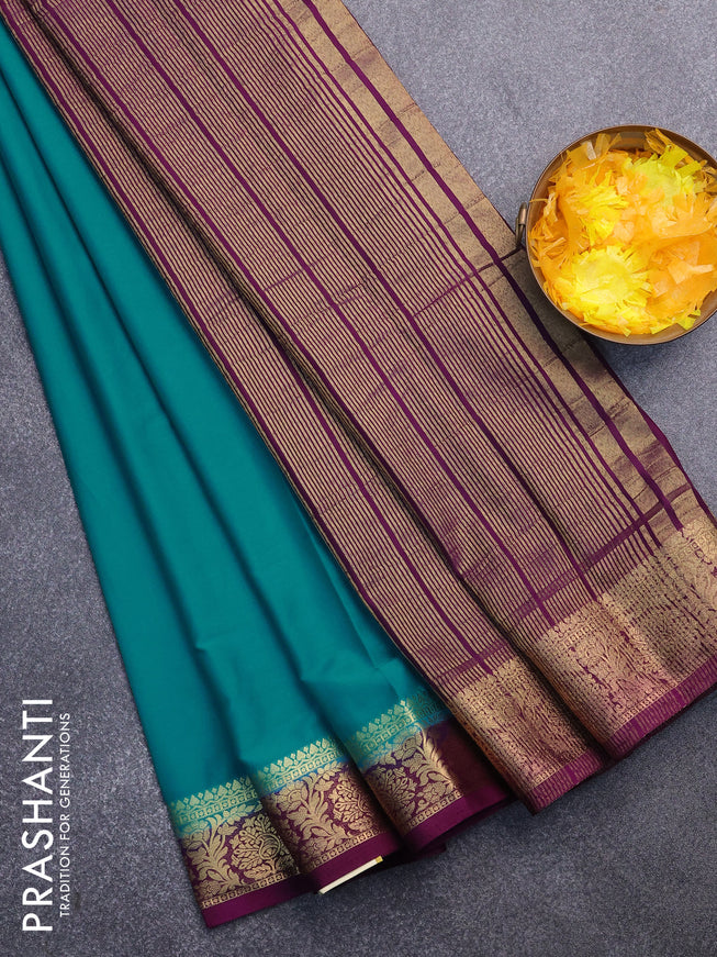 Semi crepe saree teal blue and purple with plain body and zari woven border