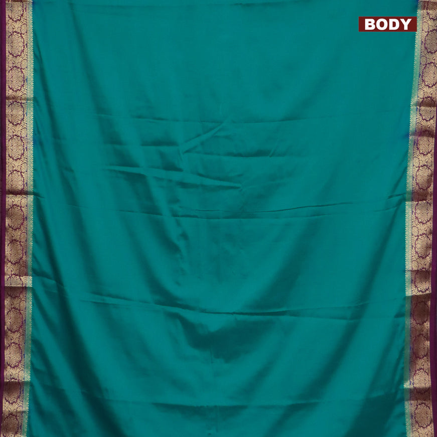 Semi crepe saree teal blue and purple with plain body and zari woven border