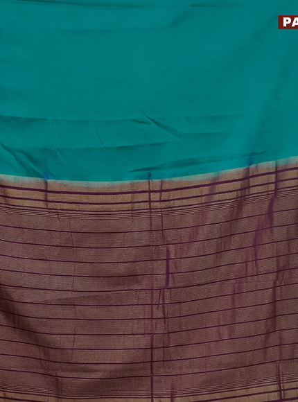 Semi crepe saree teal blue and purple with plain body and zari woven border