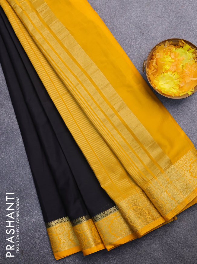 Semi crepe saree black and mango yellow with plain body and zari woven border