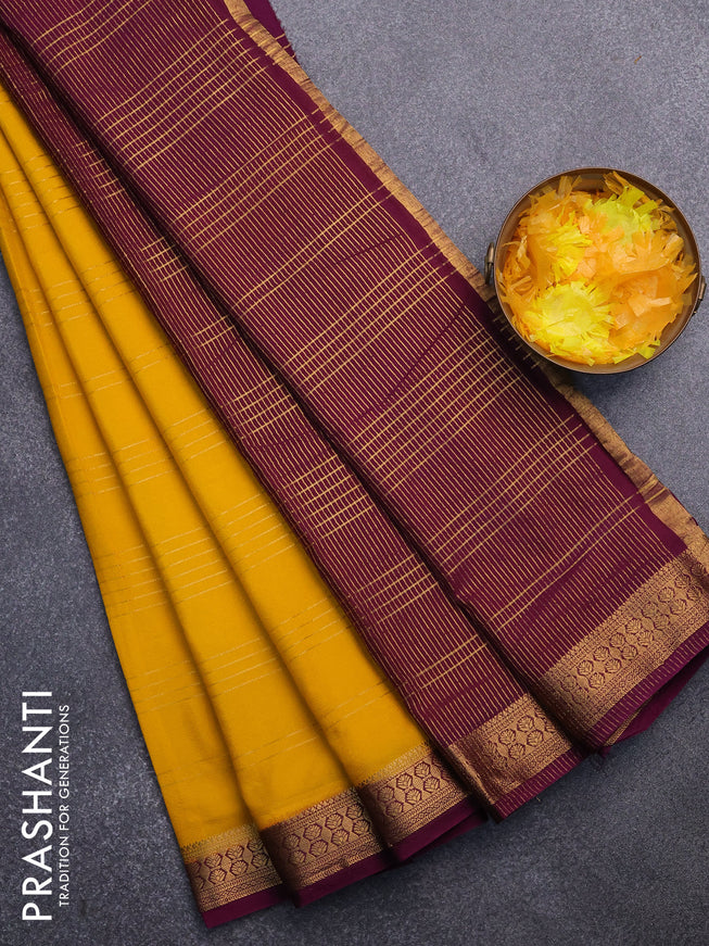 Semi crepe saree yellow and purple with allover zari stripe pattern and zari woven border