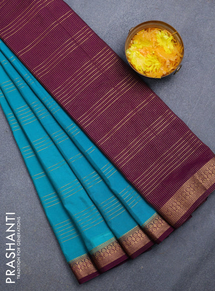 Semi crepe saree teal green shae and purple with allover zari stripe pattern and zari woven border