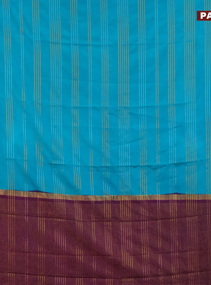 Semi crepe saree teal green shae and purple with allover zari stripe pattern and zari woven border