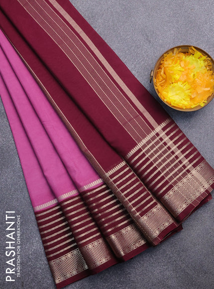 Semi crepe saree mauve pink and wine shade with plain body and long zari woven border