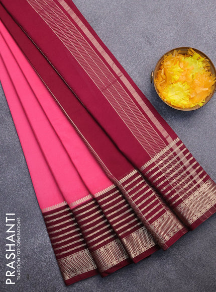 Semi crepe saree peach pink and wine shade with plain body and long zari woven border