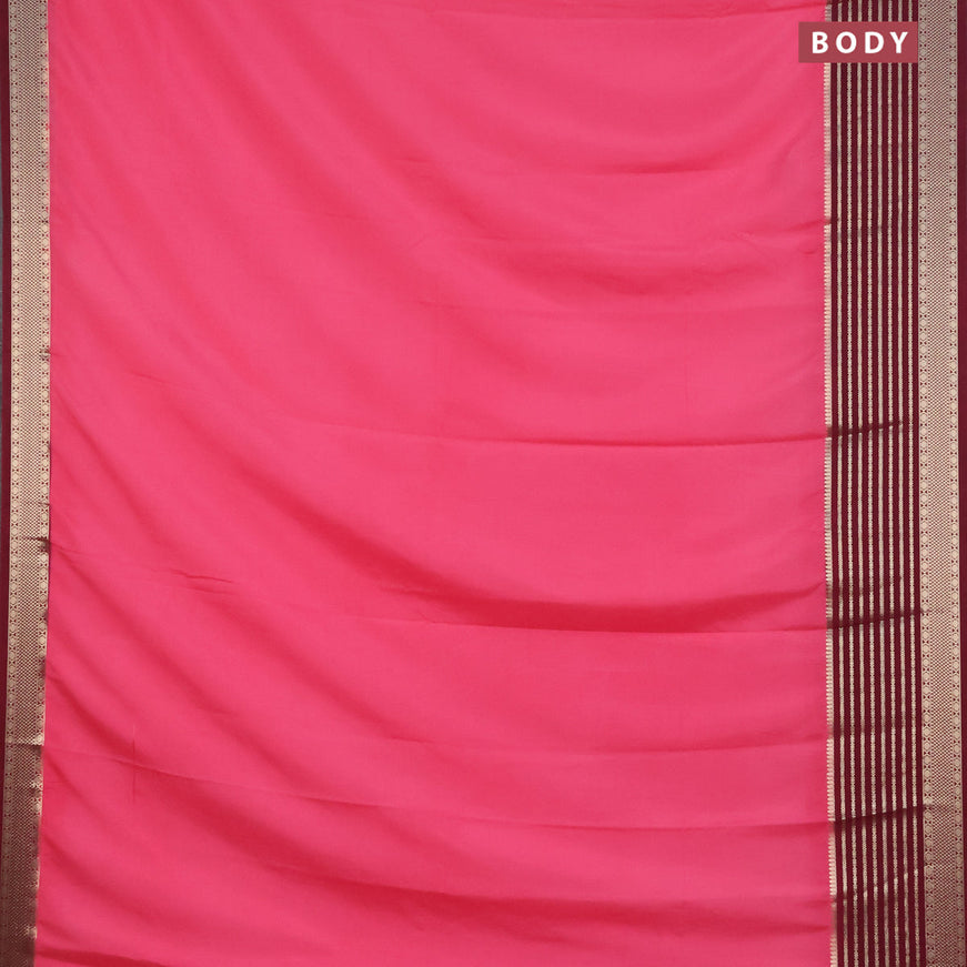 Semi crepe saree peach pink and wine shade with plain body and long zari woven border