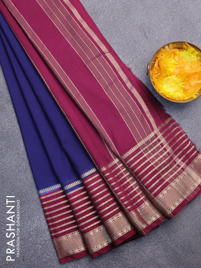 Semi crepe saree navy blue and wine shade with plain body and long zari woven border