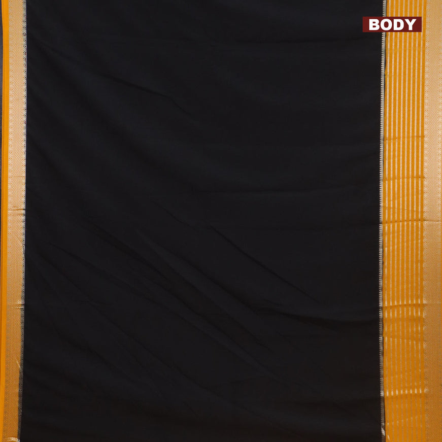 Semi crepe saree black and mango yellow with plain body and long zari woven border