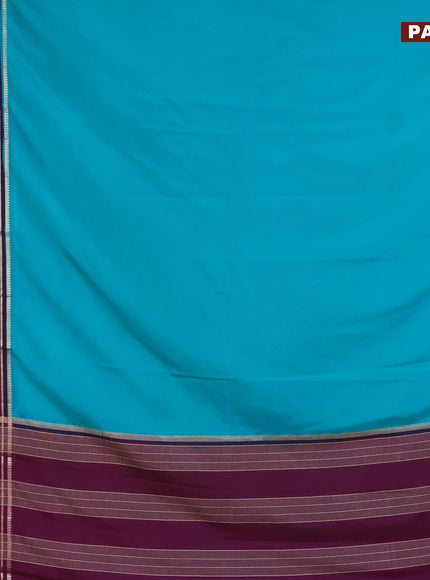 Semi crepe saree teal green shade and purple with plain body and long zari woven border