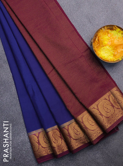 Semi crepe saree dark blue and deep purple with plain body and paisley zari woven border