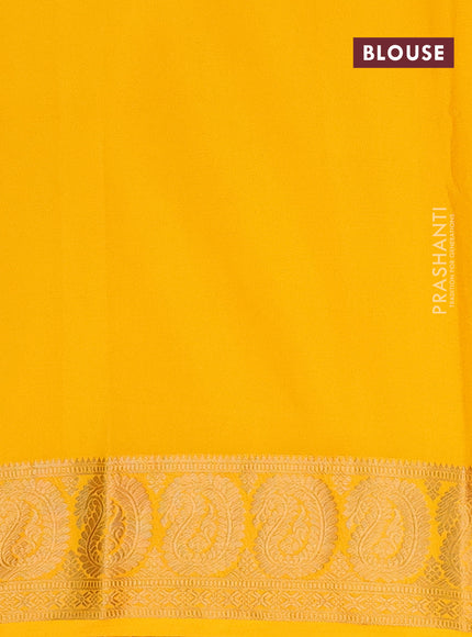 Semi crepe saree black and mango yellow with plain body and paisley zari woven border