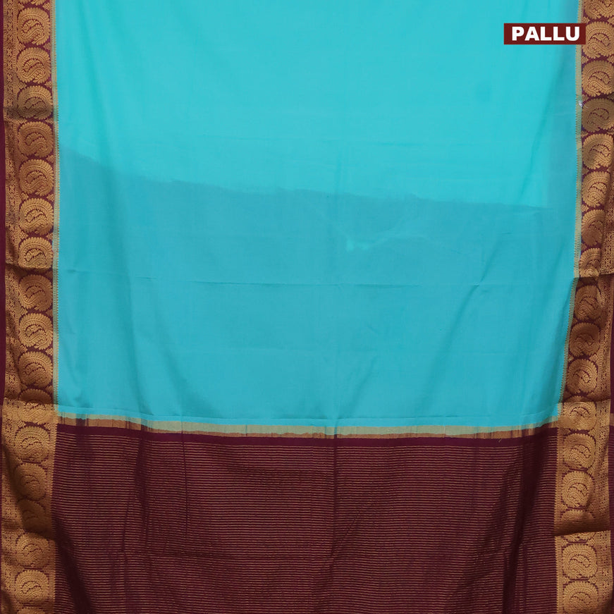 Semi crepe saree teal blue and wine shade with plain body and paisley zari woven border