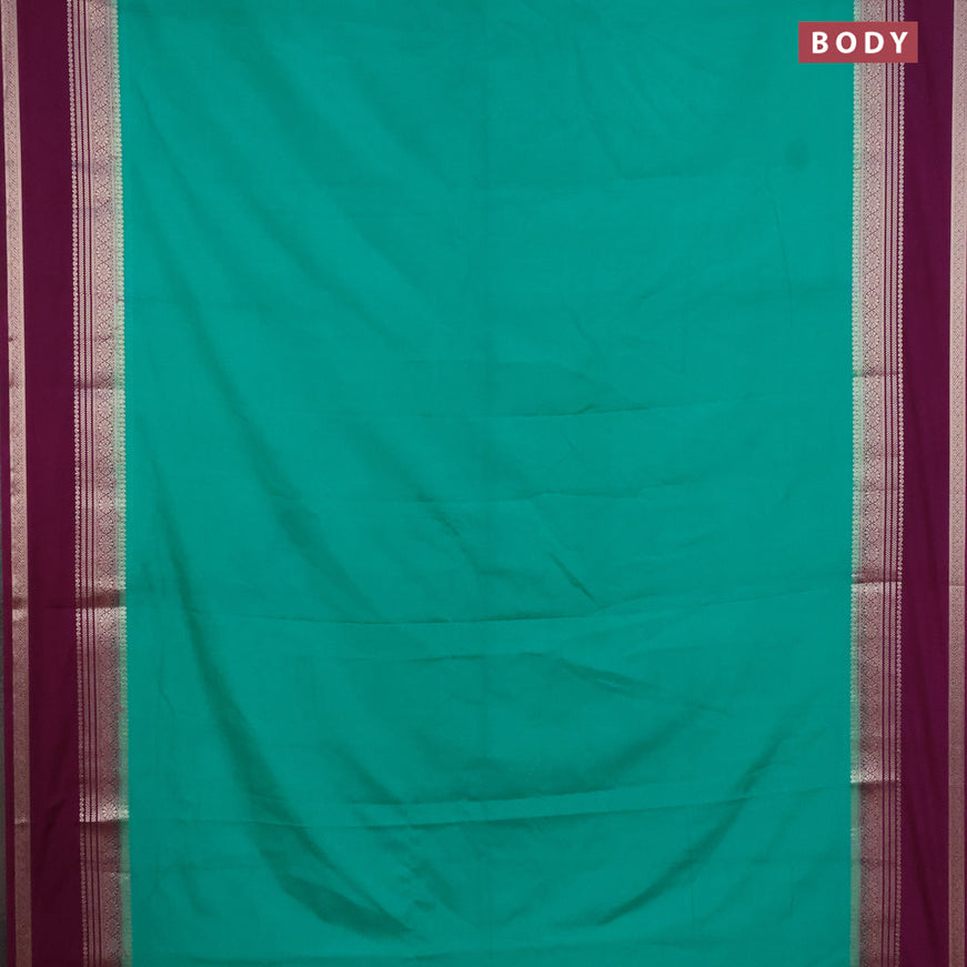 Semi crepe saree teal green shade and purple with plain body and rettapet zari woven border