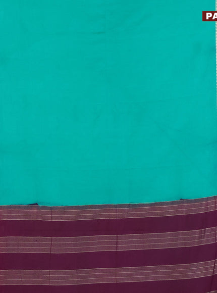 Semi crepe saree teal green shade and purple with plain body and rettapet zari woven border