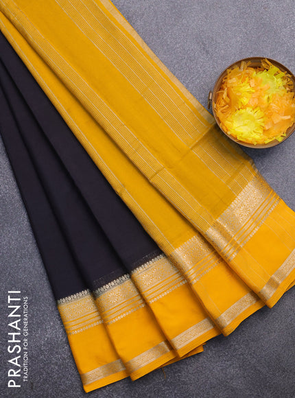 Semi crepe saree black and mango yellow with plain body and rettapet zari woven border