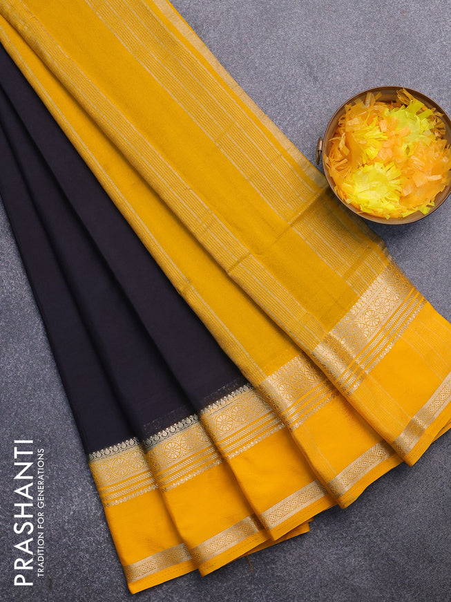 Semi crepe saree black and mango yellow with plain body and rettapet zari woven border