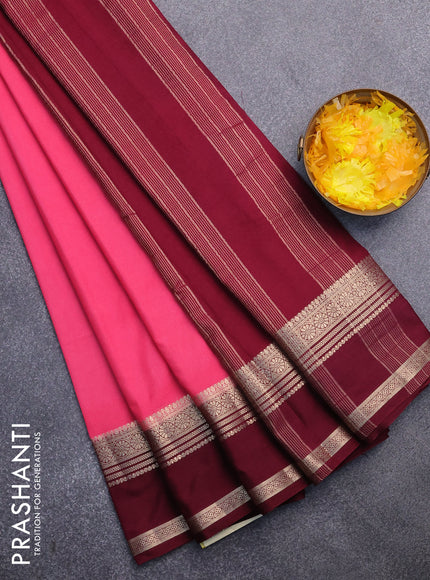 Semi crepe saree peach pink and maroon with plain body and rettapet zari woven border