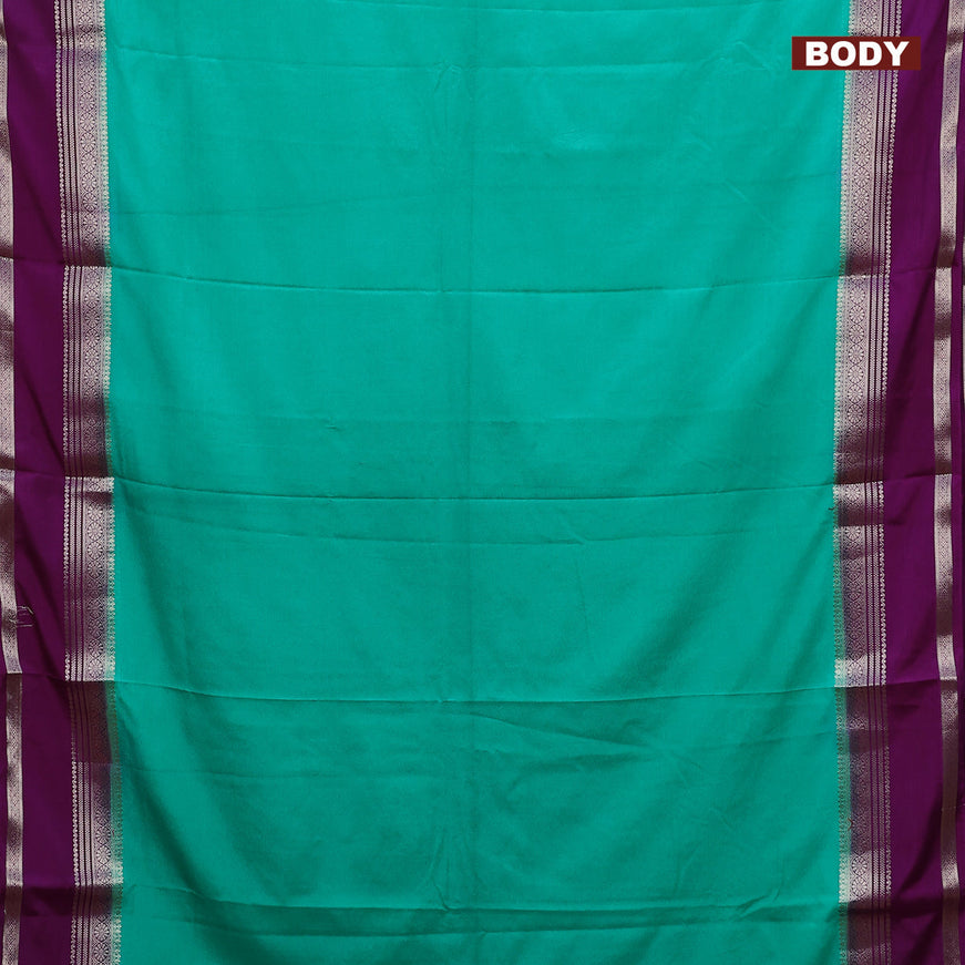 Semi crepe saree teal green and purple with plain body and rettapet zari woven border