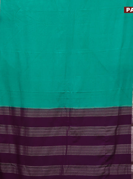 Semi crepe saree teal green and purple with plain body and rettapet zari woven border