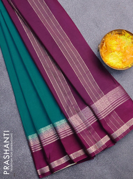 Semi crepe saree teal blue shade and purple with plain body and rettapet zari woven border