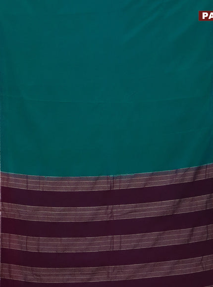 Semi crepe saree teal blue shade and purple with plain body and rettapet zari woven border