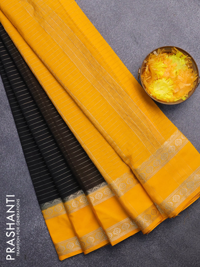 Semi crepe saree black and mango yellow with allover zari stripe pattern and rettapet zari woven border