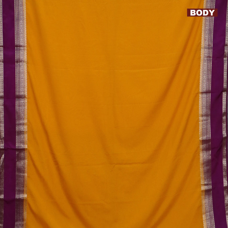 Semi crepe saree mango yellow and purple with plain body and rettapet zari woven border