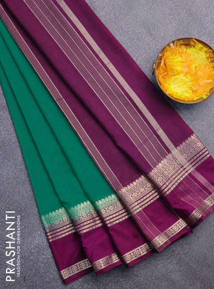 Semi crepe saree teal green and purple with plain body and rettapet zari woven border