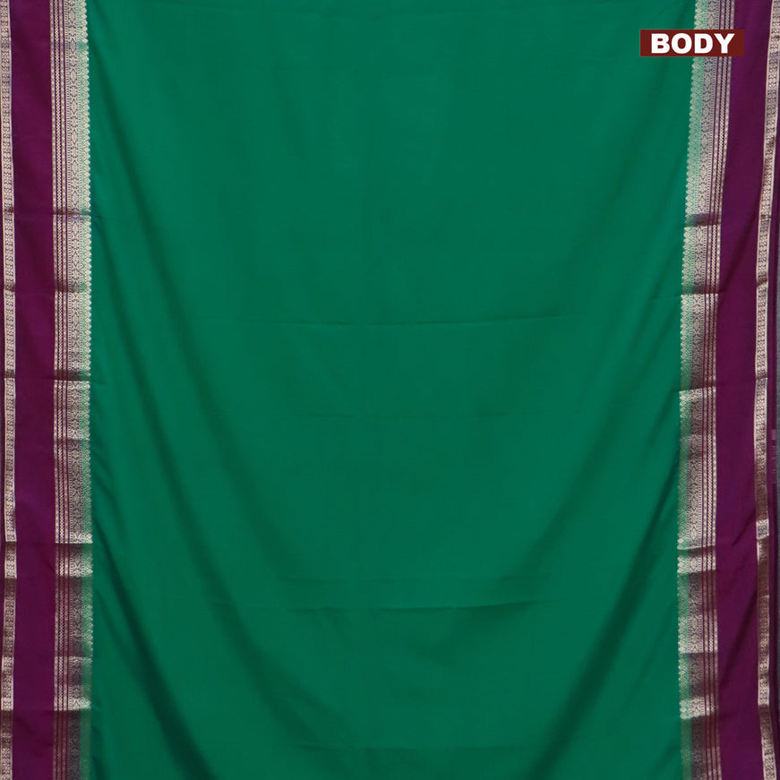 Semi crepe saree teal green and purple with plain body and rettapet zari woven border