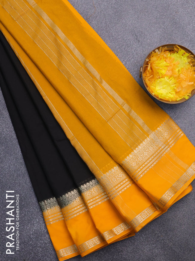 Semi crepe saree black and mango yellow with plain body and rettapet zari woven border