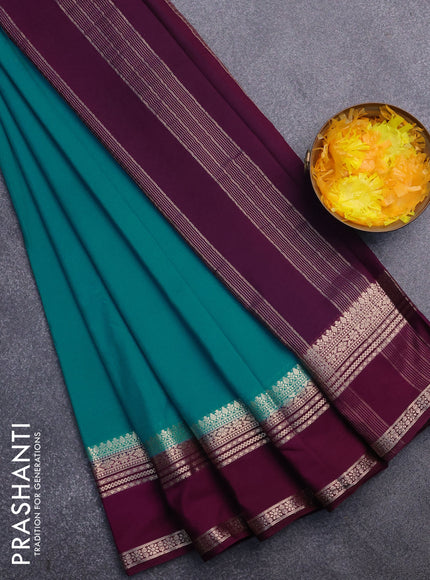 Semi crepe saree teal blue shade and purple with plain body and rettapet zari woven border