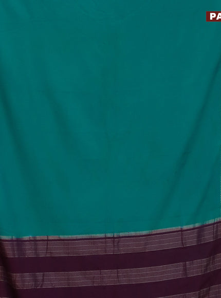 Semi crepe saree teal blue shade and purple with plain body and rettapet zari woven border