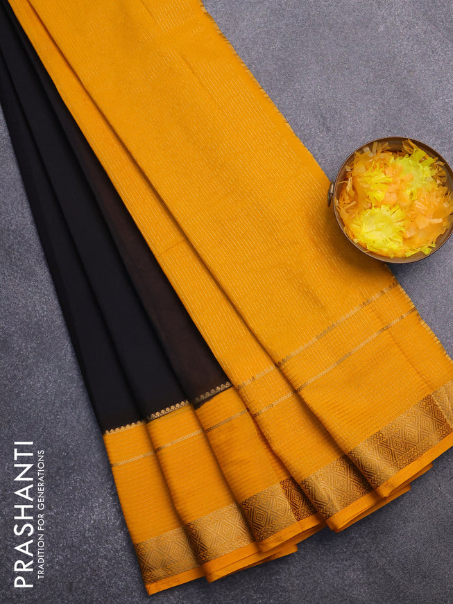 Semi crepe saree black and mango yellow with plain body and long zari woven border