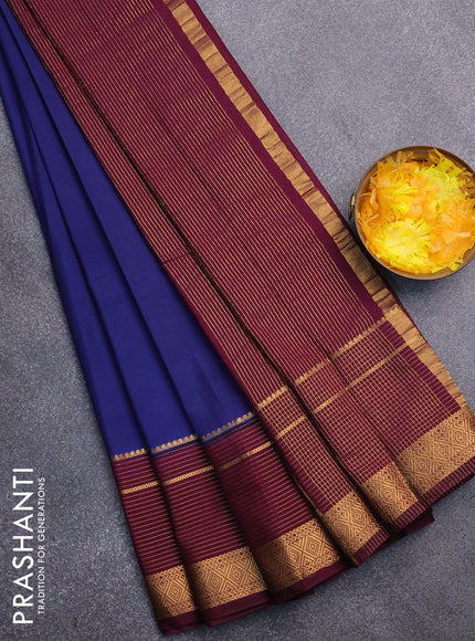 Semi crepe saree navy blue and wine shade with plain body and long zari woven border