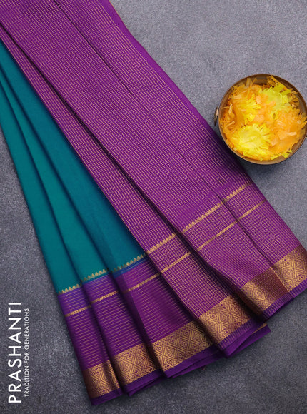 Semi crepe saree teal blue shade and violet with plain body and long zari woven border