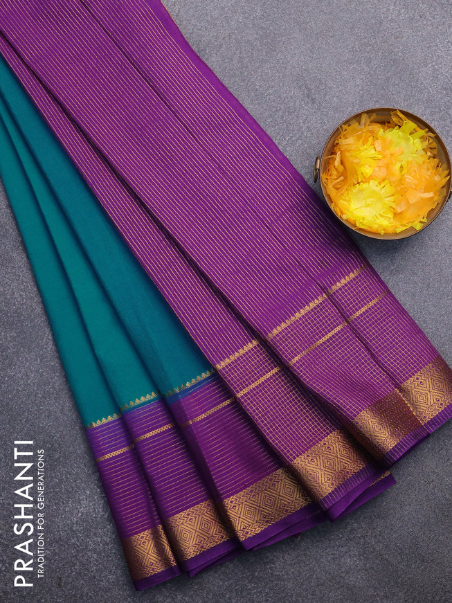 Semi crepe saree teal blue shade and violet with plain body and long zari woven border