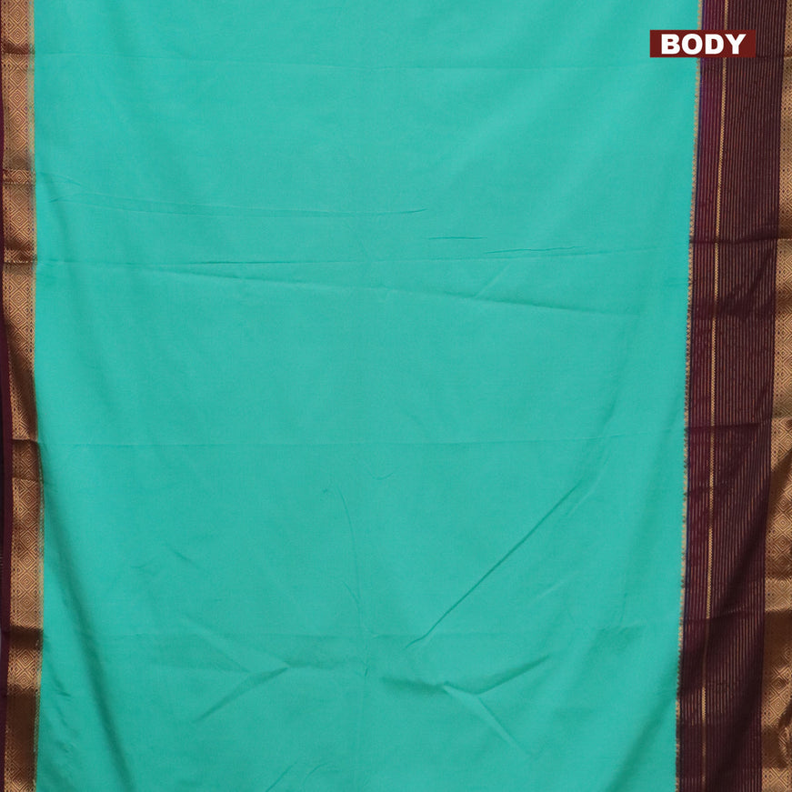 Semi crepe saree teal blue and wine shade with plain body and long zari woven border