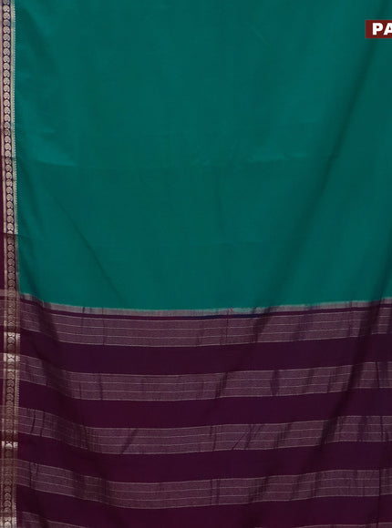 Semi crepe saree teal blue and purple with plain body and long rettapet zari woven border