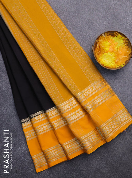 Semi crepe saree black and mango yellow with plain body and long rettapet zari woven border